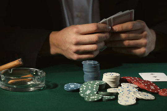 Male player at table in casino