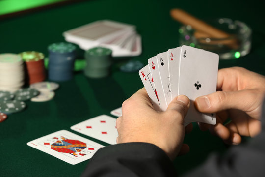 Male player at table in casino