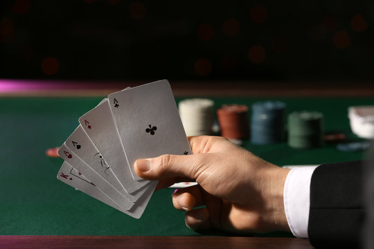 Male player at table in casino