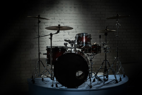 Drum set on a background of brick wall