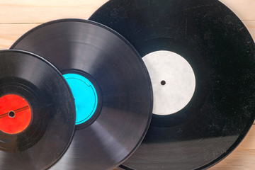 Obraz premium Vinyl record in front of a collection of albums, vintage process. Copy space for text
