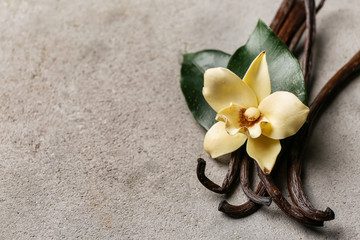 Aromatic vanilla sticks on grey background