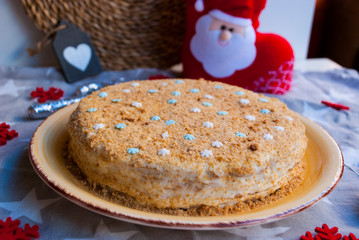 Homemade honey cake with christmas decoration. Food background holiday.