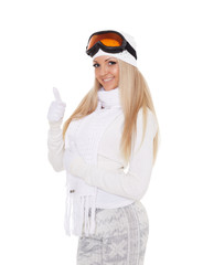 Young woman  in winter warm clothes and ski glasses.