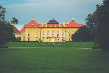 Fototapeta na wymiar Austerlitz Castle - a stunning baroque palace at twilight with gold sunset reflecting from the windows. Slavkov u Brna, South Moravia, Czech Republic.