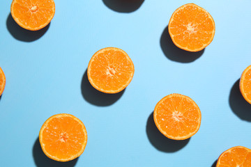 Many pieces of orange on color background