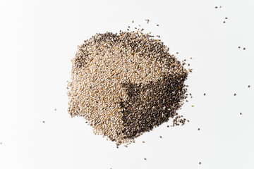 Black and white chia seeds mixed superfood on white background. Cicrle chape