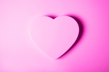 Pink heart on gradient background.