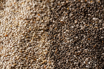 Black and white chia seeds texture. Superfood closeup, selective focus