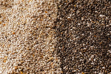 Black and white chia seeds texture. Superfood closeup, selective focus