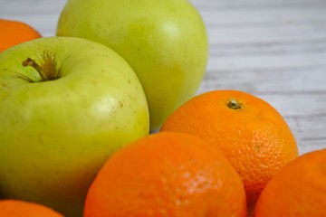 Delicious and fresh fruit on wooden background.