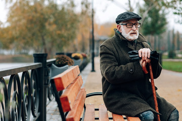 Thoughtful bearded man waiting his senior wife