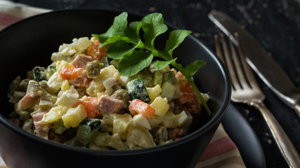 Bowl with traditional festive russian salad Olivie