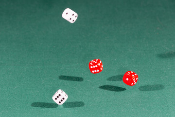 White, red and blue dices falling