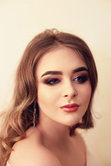 Beautiful model girl with Fashion Luxury Makeup, long eyelashes, perfect skin facial make-up. Beauty Brunette model woman holiday make up close up. Eyelash extensions, false eyelashes. Beauty Woman.