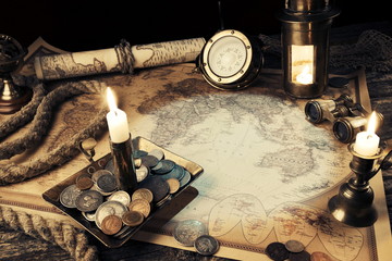 Pirate map.Ship lantern.Old coins,rope and binoculars,compass.Old Zodiac globe,astrological. Travel and marine engraving background. Vintage style.Treasure hood concept.Gold and silver