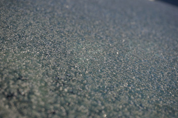 beautiful frosty patterns on the glass of the car