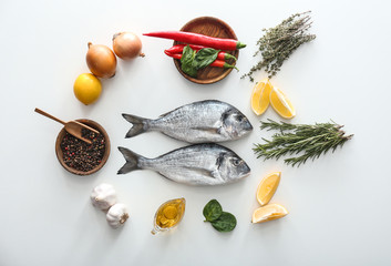 Fresh dorado fish and ingredients on white background