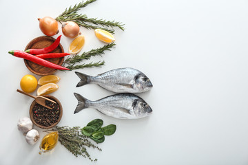 Fresh dorado fish and ingredients on white background