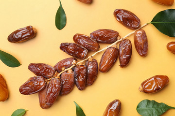 Sweet dried dates on color background