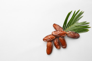 Sweet dried dates on white background