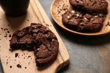 Tasty chocolate cookies on grey table