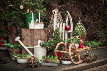 Christmas decorations on the street with old wooden sled. Christmas festive background - 241570088