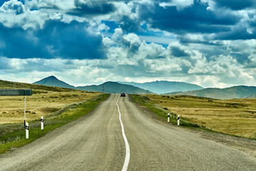 Beautiful landscape of steppe and stone mountains along the road from the city of Ust-Kamenogorsk to the Sibiny lakes (RU: Sibinskiye Ozora: Sadyrkol, Tortkara, Shalkar, Korzhynkol), East Kazakhstan