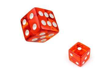 Two red glass playing dice isolated on a white background. Alone and flying in the air, top view.