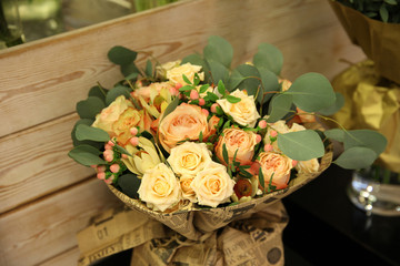 Beautiful bouquet of cream and peach roses in vintage style