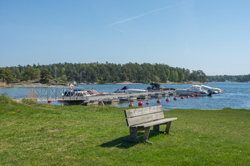 Leisure boats are moored in a bay on Värmdö on a fine summer day