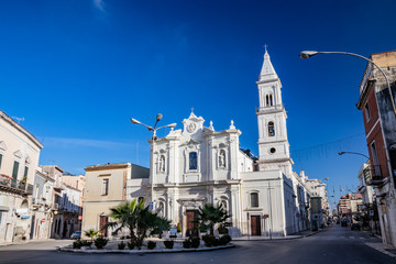 Baroque Church of the Blessed Virgin of Mount Carmel, Carmine Church, dating back to the 16th century, built by the Carmelite friars. Niche with marble statues on the facade. Cerignola, Puglia, Italy. - obrazy, fototapety, plakaty