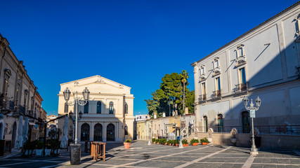 Municipal Theater Saverio Mercadante, 1868. Facade with two galleries. Ancient building, balconies, iron railings, liberty style street lamps. In piazza Giacomo Matteotti, in Cerignola, Puglia, Italy.