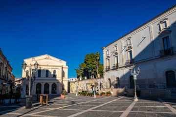 Fototapeta premium Municipal Theater Saverio Mercadante, 1868. Facade with two galleries. Ancient building, balconies, iron railings, liberty style street lamps. In piazza Giacomo Matteotti, in Cerignola, Puglia, Italy.