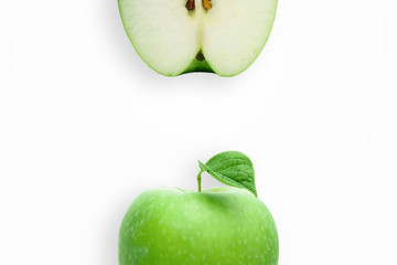Creative background, green apple and slices of apple on a white background. Flat lay, copy space, layout. The concept of nutrition, fresh fruit, natural products, juice.