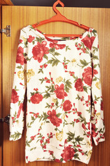 fashion beautiful shirt or sweater with roses pattern.