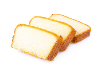 Sliced moist butter cake isolated on white background.