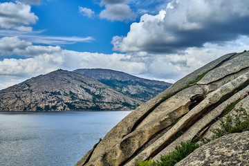 Beautiful landscape with stone rock mountains oraund of the Sibiny lakes (RU: Sibinskiye Ozora: Sadyrkol, Tortkara, Shalkar, Korzhynkol), neer the city of Oskemen (RU: Ust-Kamenogorsk) East Kazakhstan