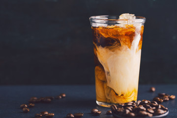 Iced coffee with cream in tall glass