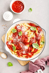 Tomato italian penne pasta served in pan