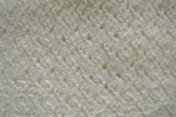 white patterns on a knitted cloth