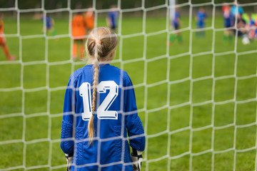 Girls' Soccer Championships Match. Girl Soccer Goalkeeper. Young Girl Football Goalkeeper Standing...