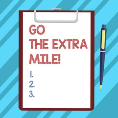 Text sign showing Go The Extra Mile. Conceptual photo Give an additional do more than is expected from you Blank Sheet of Bond Paper on Clipboard with Click Ballpoint Pen Text Space