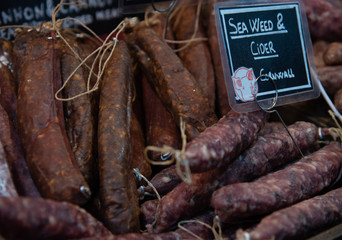 Fresh delicious sausages on a food market
