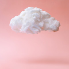 White cloud against pastel coral color background. Weather minimal concept. - obrazy, fototapety, plakaty