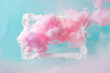 White vintage frame on pastel blue background with abstract pink cloud shapes. Minimal border composition. - obrazy, fototapety, plakaty