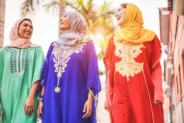Zelfklevend Fotobehang Happy arabic friends walking in city center © DisobeyArt