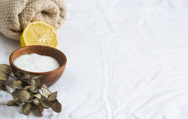 Fototapeta na wymiar Natural Ingredients for Homemade Body Sea Salt Scrub Lemon Olive Oil Towel Beauty Concept Skincare Organic Aroma Spa Therapy