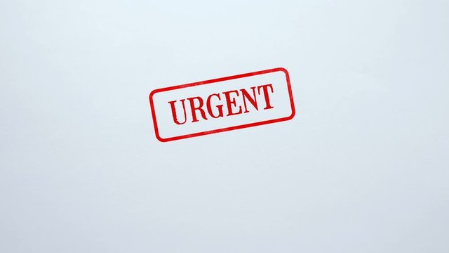 Urgent seal stamped on blank paper background, priority task, assignment