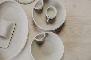 Decorative clay plates, on a wood background with copy space.